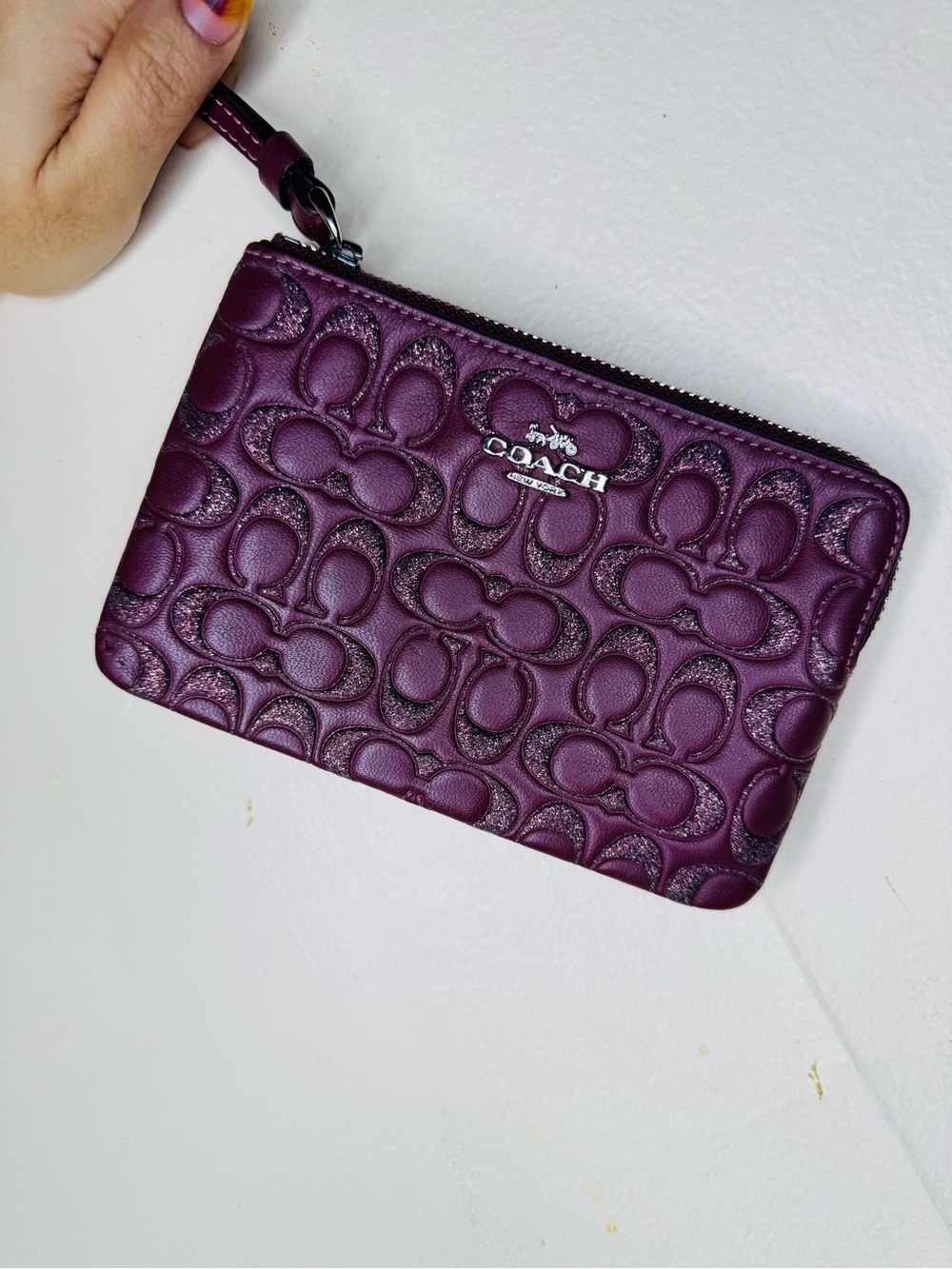 COACH Plum Signature Embossed Leather Wristlet